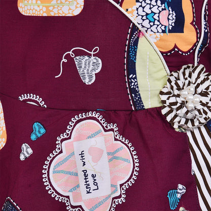 Girls Maroon Printed Cotton Dress with Asymmetrical Panel & Floral Accent